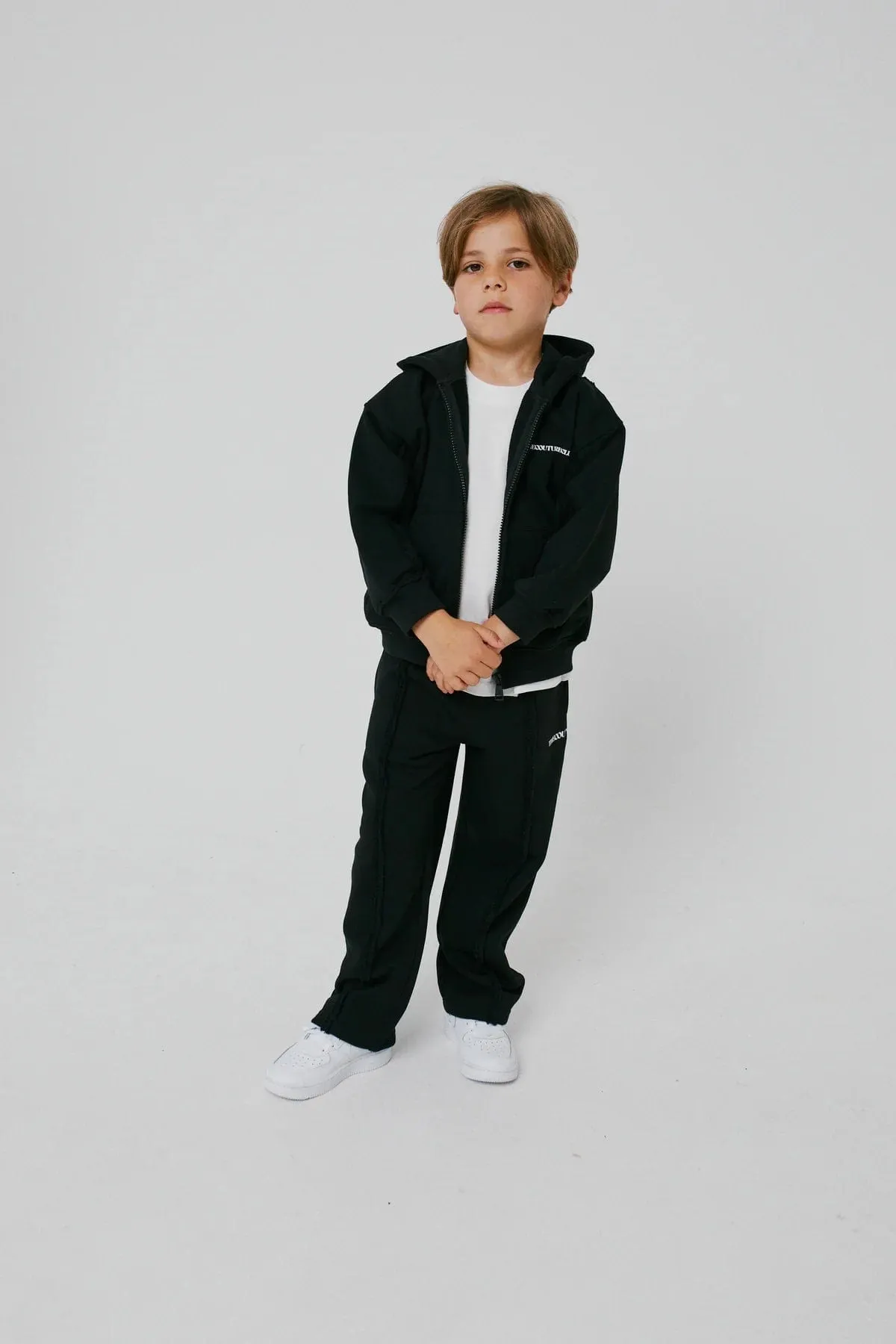 The Couture Club Kids Raw Seam Joggerhose exklusiv für Mitglieder in Schwarz